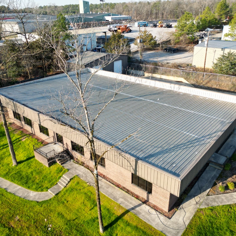 Commercial metal roof before restoration work